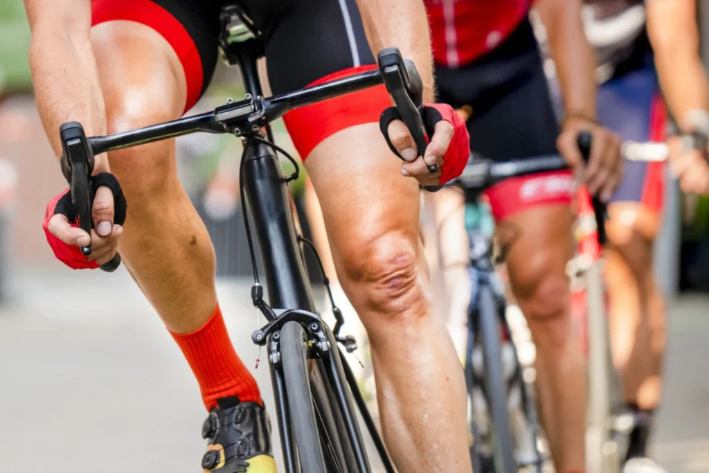 5 Essential Treatments For Sports Injuries Manchester Athletes Face: Your Complete Guide To Sports Injury First Aid 4 cyclists riding together