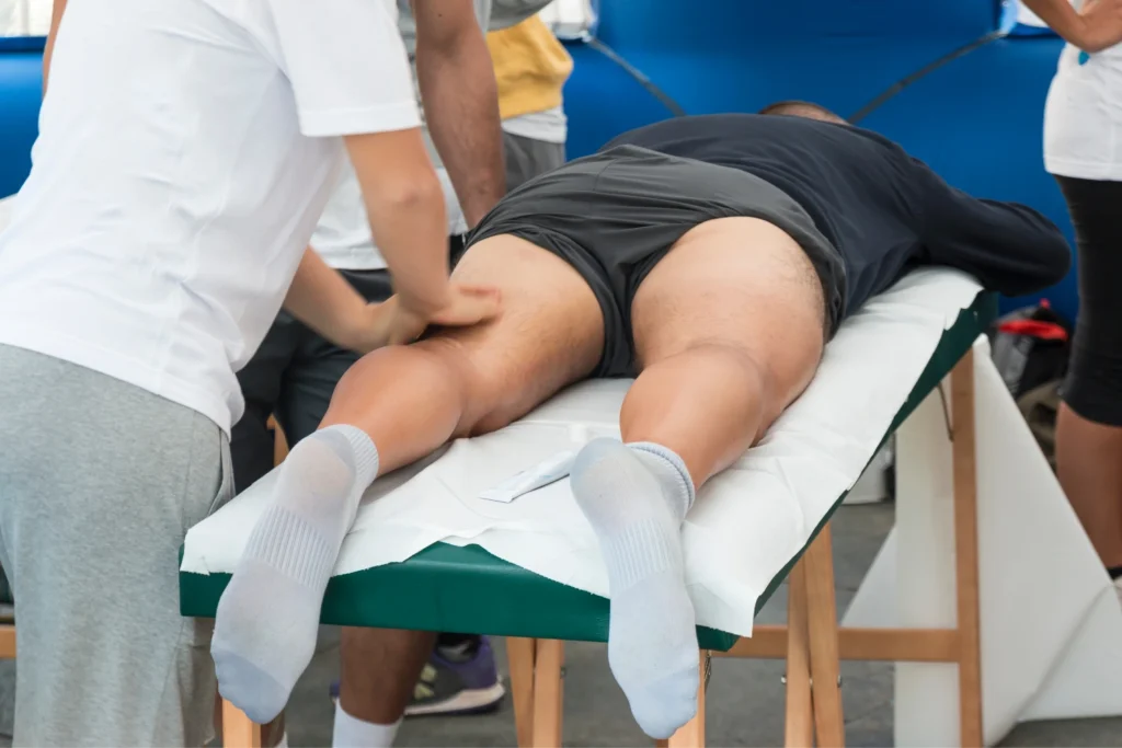 Still Sore After Every Workout? Reset With Sports Massage In Manchester 2 footballer getting intensive sports massage