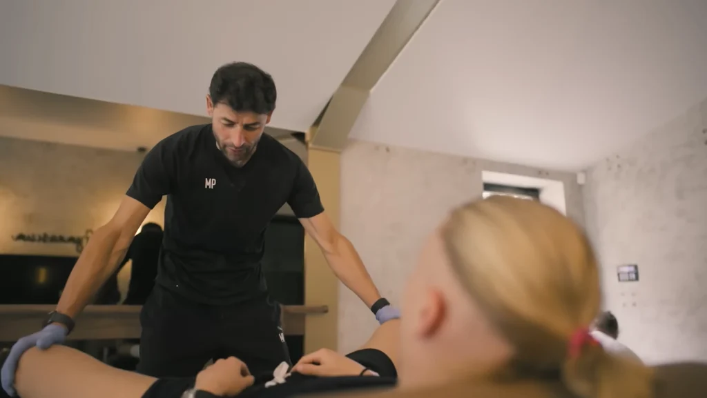 haaland having hip flexing with his physio in haaland first youtube video