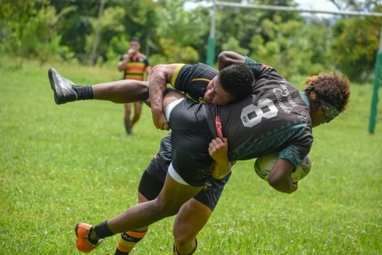 a rugby player tacking another rugby player, and he may need recovery