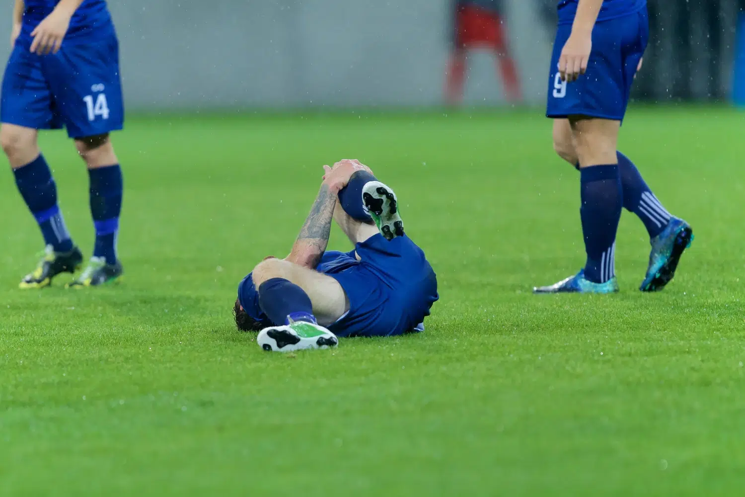 injured footballer in the floor representing cole palmer injury