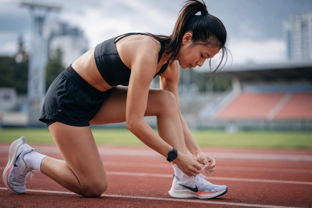 Female athlete preparing for training in Manchester for professional sports therapy
