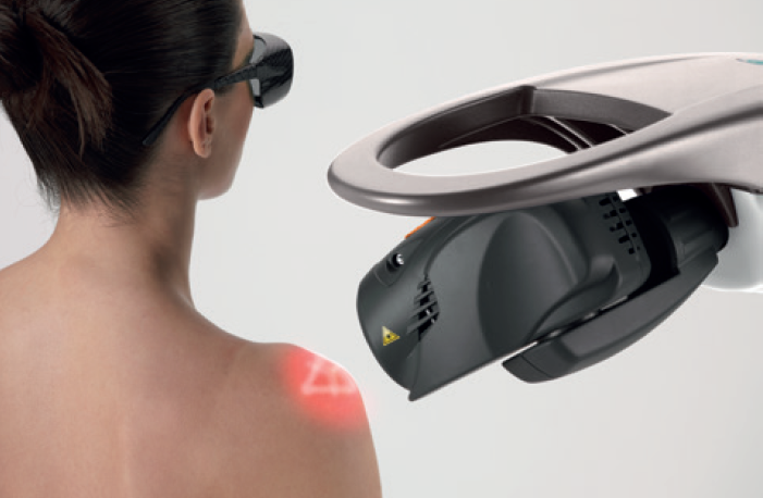 ASA M8 robotic laser arm targeting a patient's shoulder during therapy session