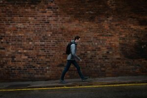 Walking benefits UK for office workers tracking steps on Manchester streets