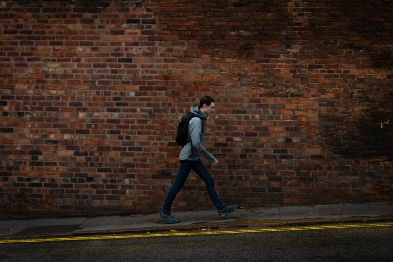 Walking benefits UK for office workers tracking steps on Manchester streets